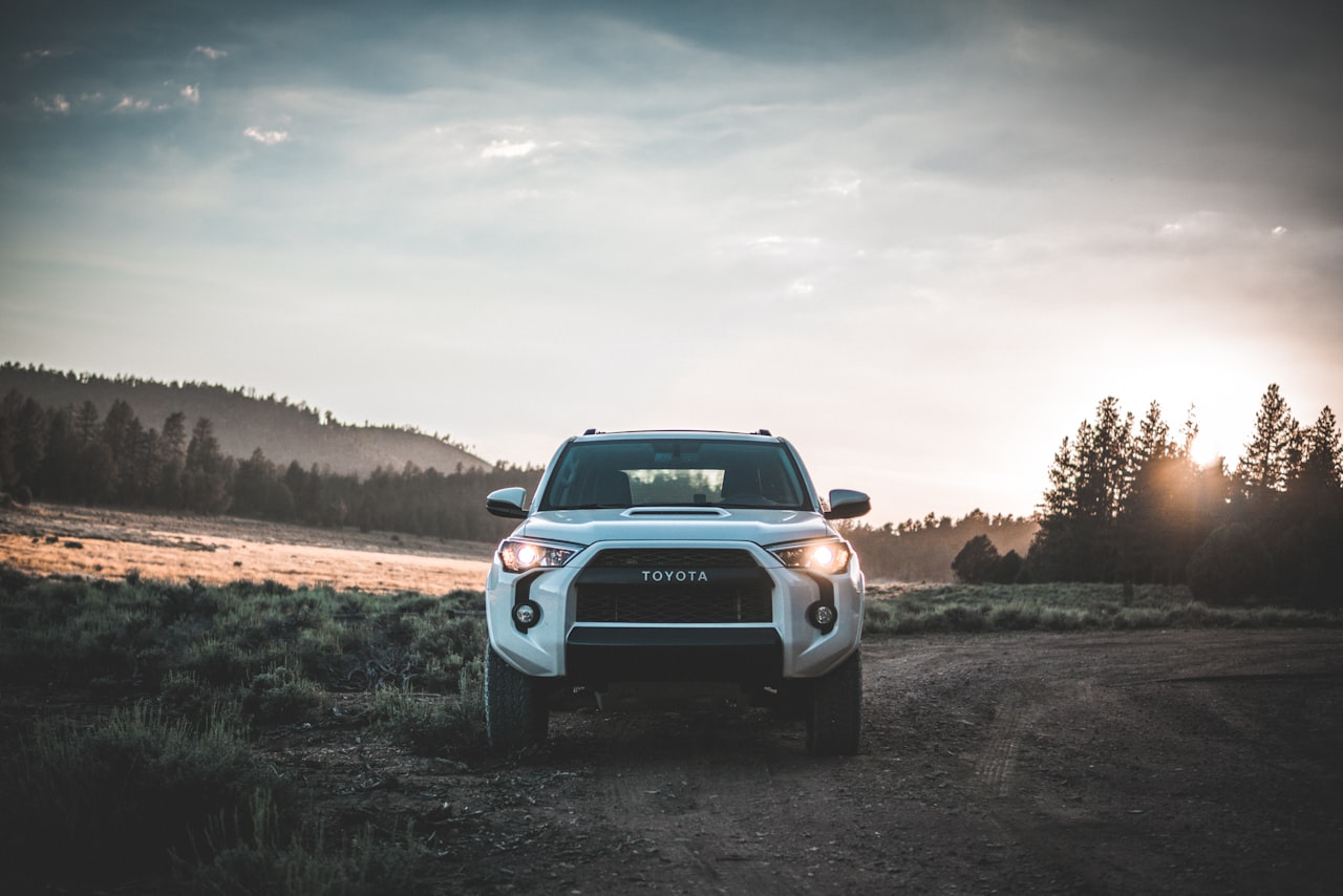 2014 Toyota 4Runner midsize SUV, white, front view at sunset
