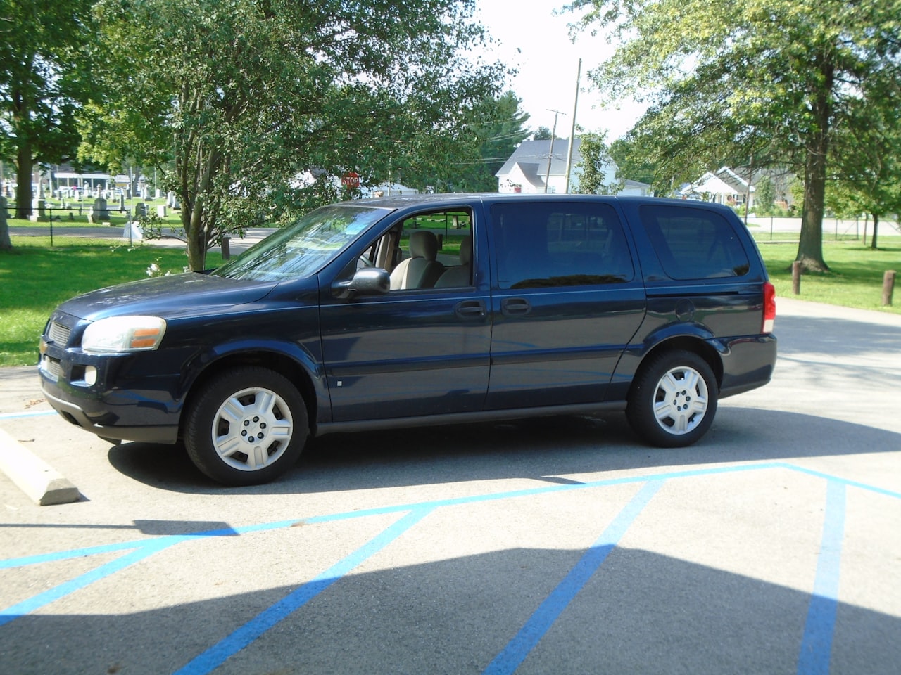 2014 Dodge Grand Caravan minivan, dark blue, parked in a lot