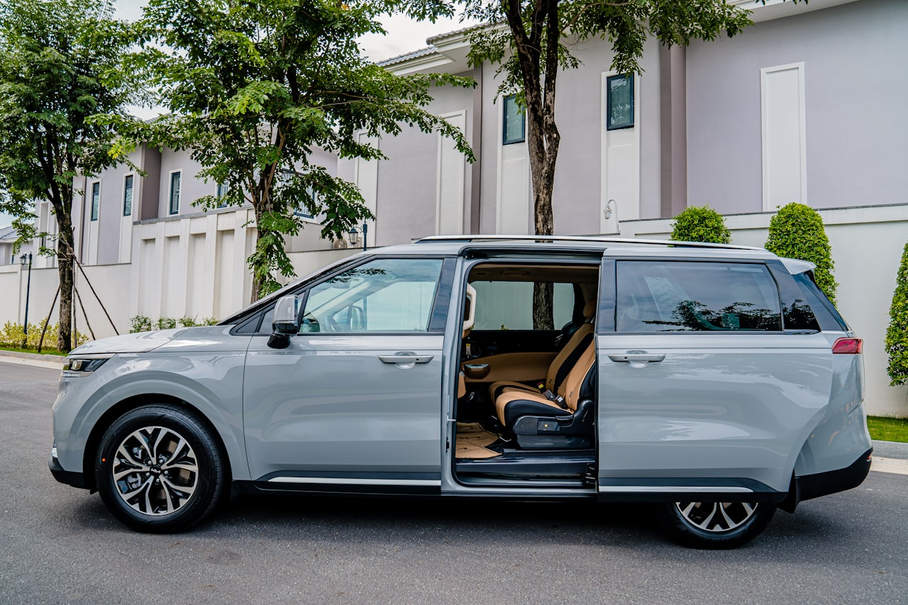 2011 Honda Odyssey minivan, silver, side profile with doors open