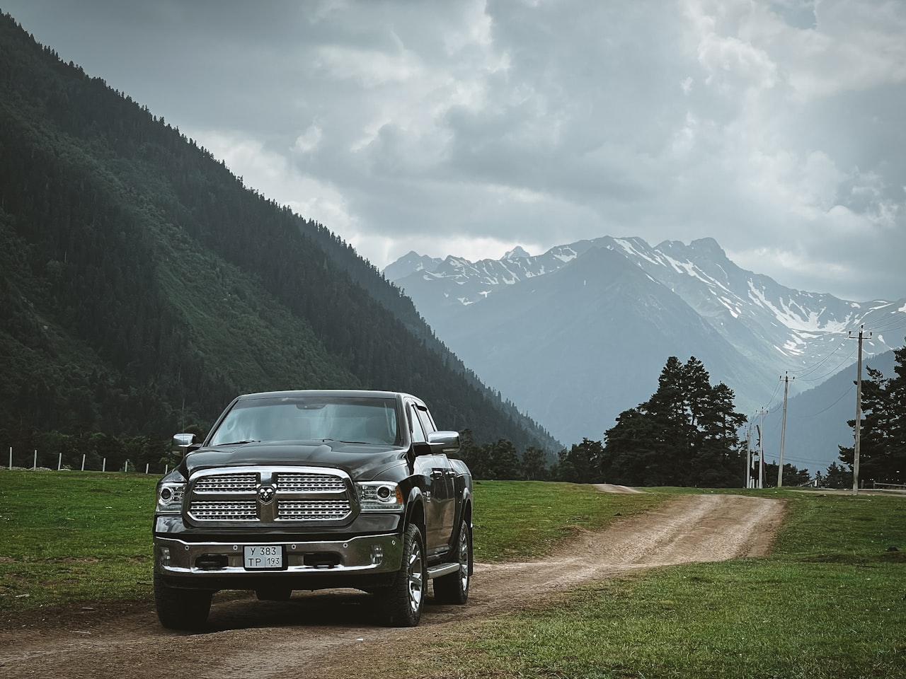 2016 Ram 1500 half-ton pickup truck, black, parked on a mountain road